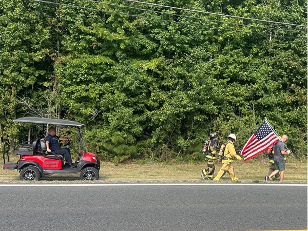 Fire fighters walked 9.11 miles in full gear honoring those on 911. Never Forget. 