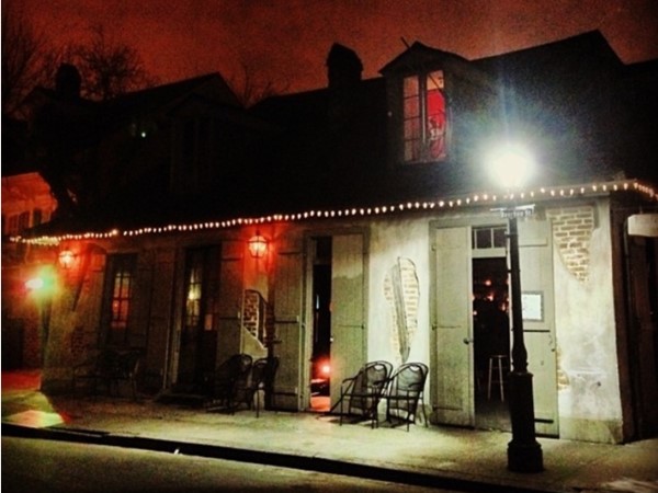 Nighttime view of historic Lafitte's Blacksmith Shop