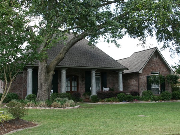 Live oaks and lush landscaping create a great neighborhood