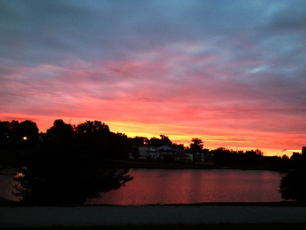 Beautiful sunrise over McKay Lake in Jefferson City! Great location for fishing, walking, and fun