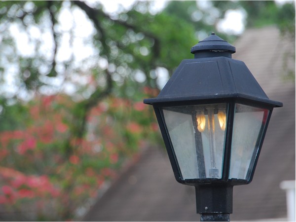 Gaslight lamps add a nostalgic touch to this area