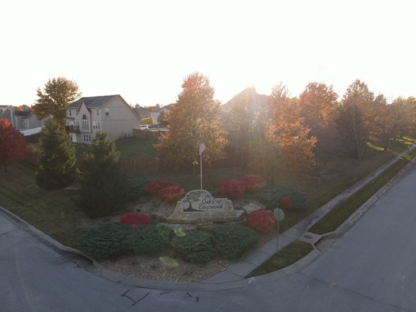 Beautiful aerial view of the entrance with sunshine glistening!! Love the fall colors