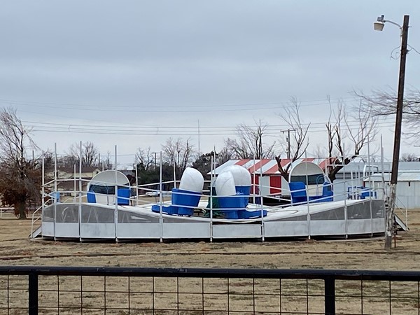 Vintage carnival rides waiting for spring in Hinton