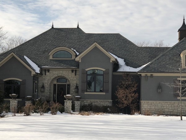 Love the stone and stucco combo on this Manderlay beauty