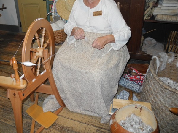 Spinning cotton into thread at the Vermilionville history museum and folklife park