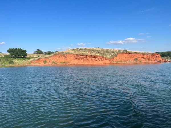 Red dirt and blue water at Foss Lake 