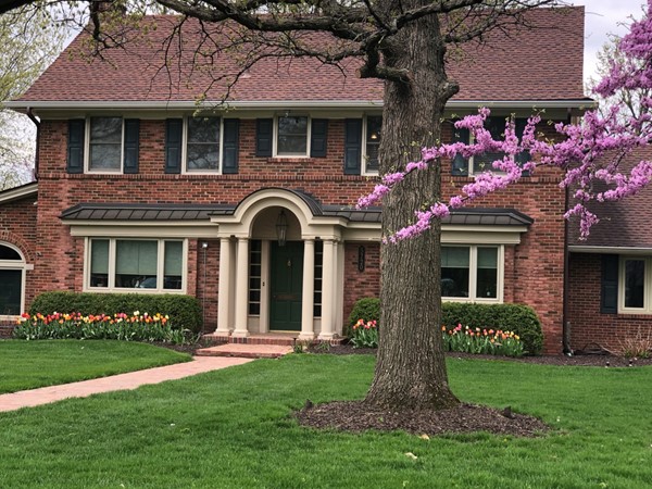 Love the spring tulips and red bud in bloom.  This home is so welcoming