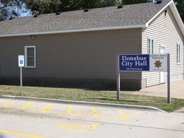 Donahue City Hall is located right next door to First Trust and Savings Bank on 1st Ave