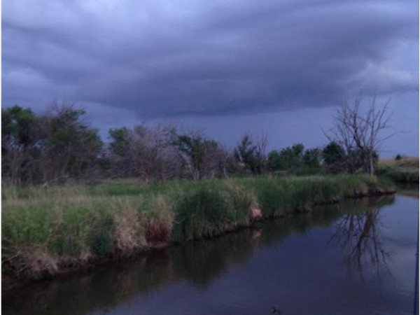 Amazing view of a storm rolling in over a creek near Lahoma