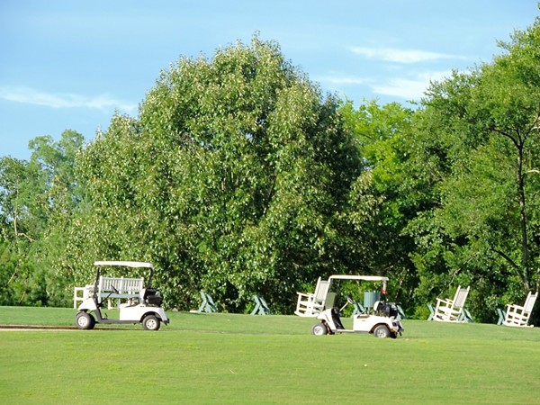 Relax in rocking chairs at the golf driving range in Canebrake
