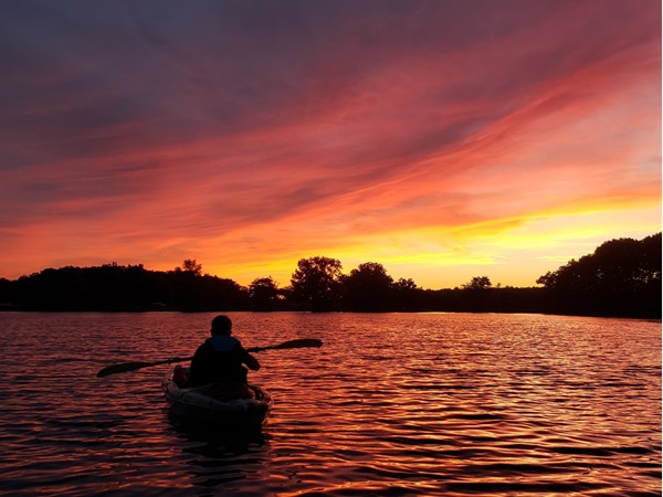 Sunset kayaking on Kent Lake in Kensington Metropark