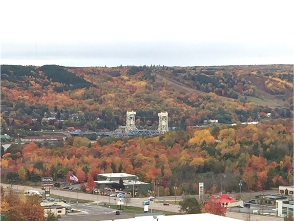 View of the Portage Lake lift bridge and Mt. Ripley ski hill. Fall color is at peak in Houghton