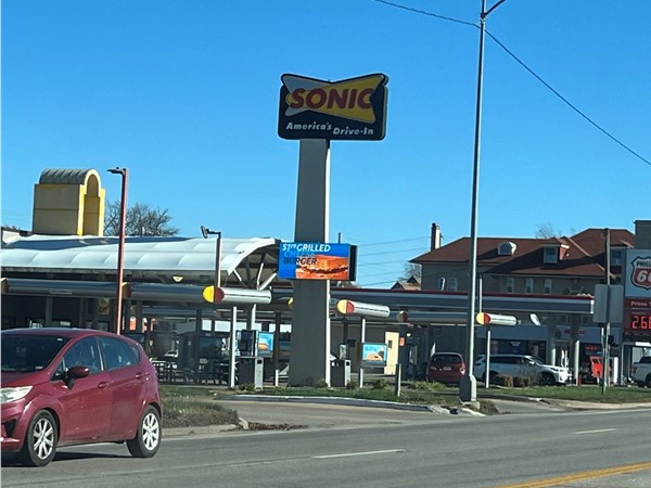 Whether it’s burgers, tots, or a cherry limeade kind of day — happiness is just a drive-in away!