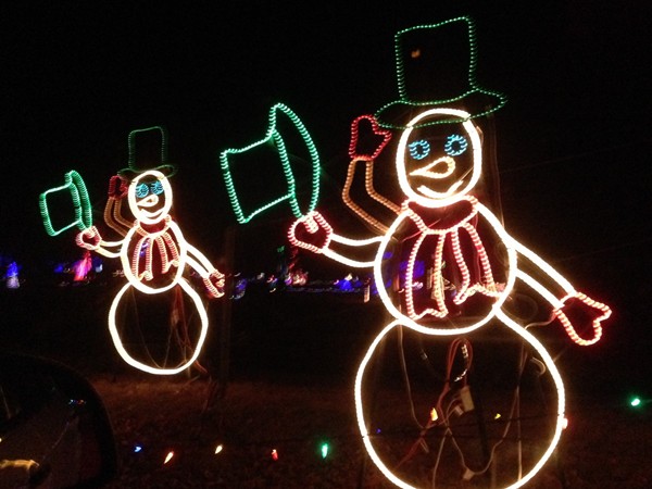 Animated snowmen tip their hats at the Longview Lake Farm holiday light display
