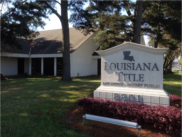 Louisiana Title - corner of Bluebonnett and Oak Hills