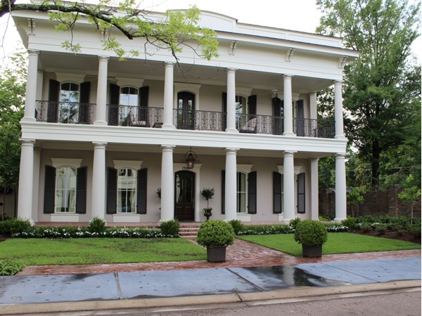 This gorgeous Southern-style antebellum home is part of exclusive Pargoud Place neighborhood