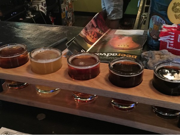 Enjoy a flight of beer at a great local Fayetteville Brewery, Fossil Cove