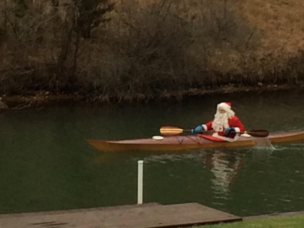 Here comes Santa kayaking down Gull Lake!