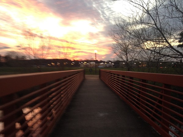 Sunset over the bridge at the Liberty Park walking trail