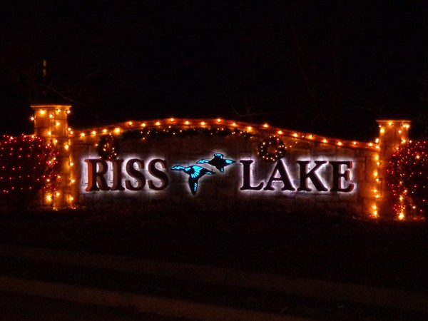 Riss Lake does it up right starting the holiday season with Christmas lights at every entrance!