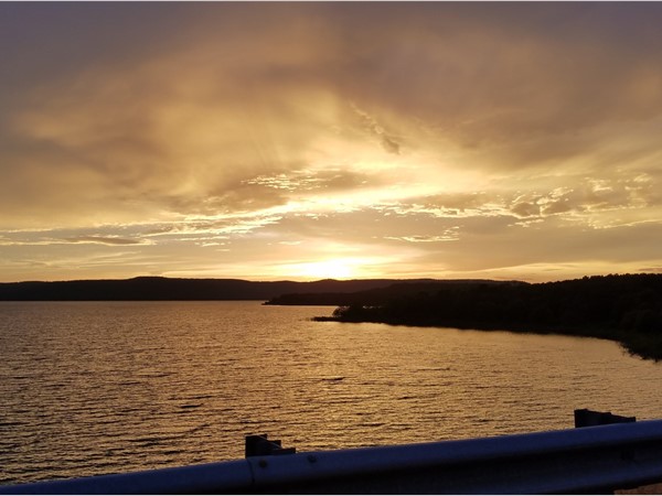 A breathtaking sunset over Greers Ferry Lake off the dyke on Highway 107