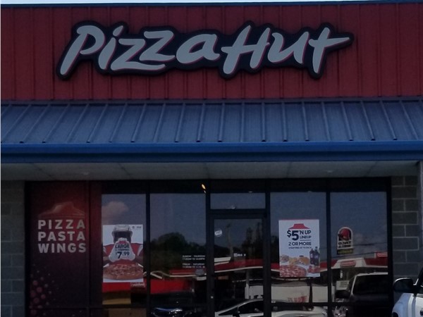 Have a pizza delivered from the Pizza Hut located on Highway 65.