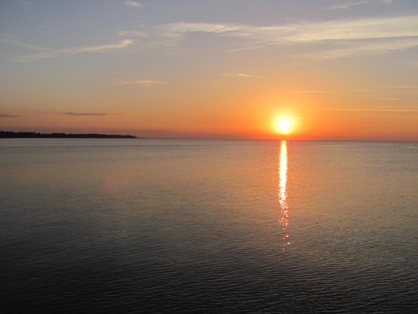 Enjoy a beautiful sunset from the pier over Mobile Bay at The Peninsula