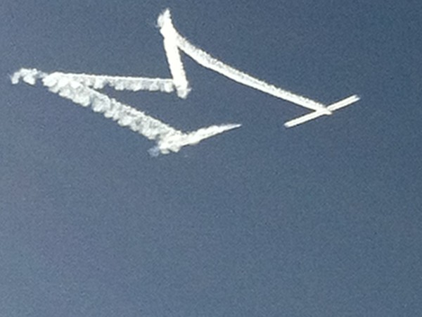 Local skywriter before a U of M home game encourages Brighton fans to come support the team!
