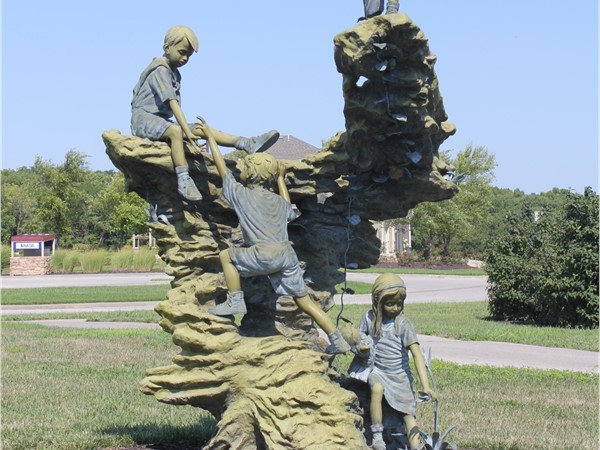 Children at play. A statue in Seven Bridges with character