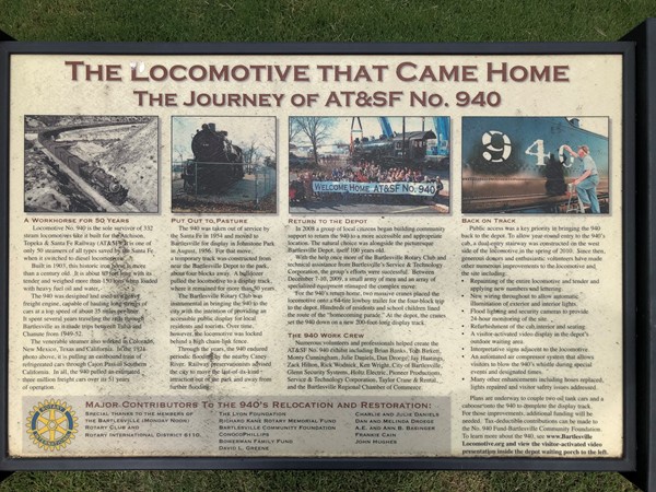 Plaque tells the history of the train engine that is in downtown Bartlesville, by the old depot 