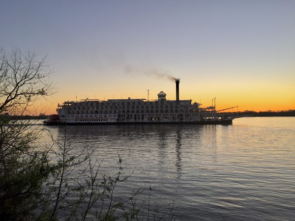 A glimpse of The American Queen, largest steamboat ever built, as she cruises down the Mississippi 