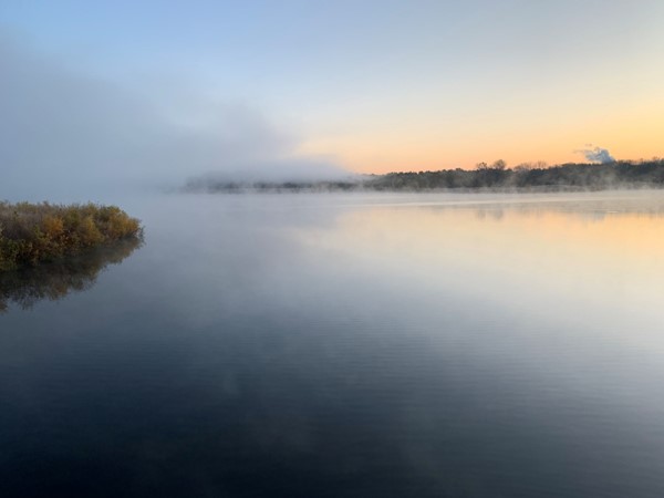 Mist rises off of Big Woods Lake 