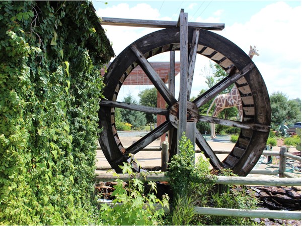 The "waterwheel" featured at Thomas Nursery & Feed is a reminder of "days gone by"