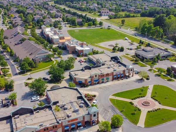 Arbor Creek Estates shopping area, town homes, and single family homes