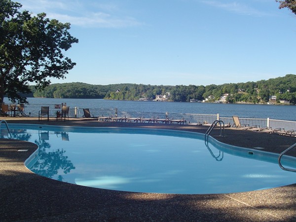 A beautiful view of the pool and lake at Bay Point Village