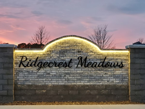 Sunset view of one of the updated Ridgecrest Meadows Subdivision entrance signs