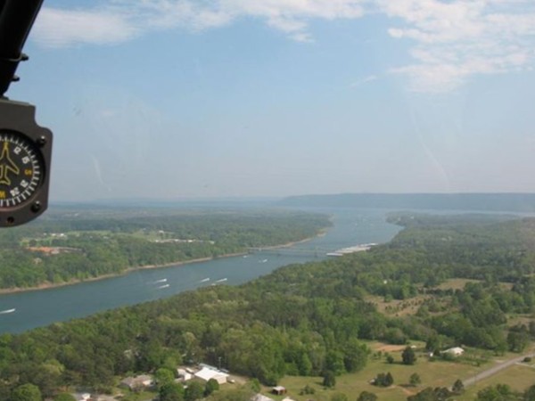 View from helicopter of boat races on Greers Ferry Lake. Narrows Bridge in distance