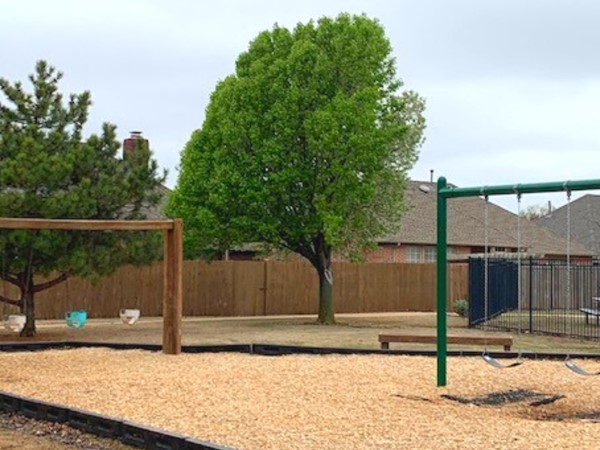 The park area offers a playground for community children, picnic areas and seating