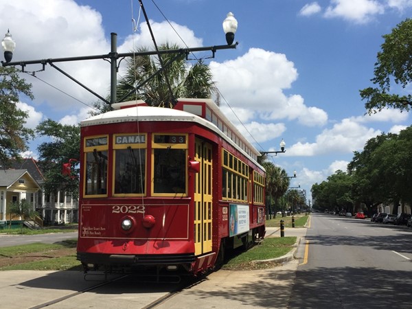 Iconic red Canal Streetcar runs through mid-city from the CBD to City Park and the cemeteries