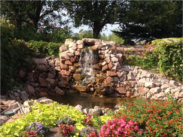 Waterfall and plantings at the entrance