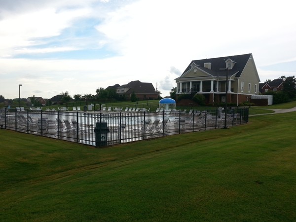 The pool at Magnolia Springs with the clubhouse in the background