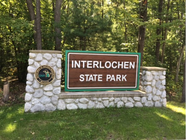 Interlochen State Park is home to miles of trails and a beautiful beach on Duck Lake