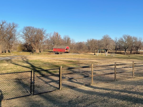 Homestead park with swings, picnic tables, and trails