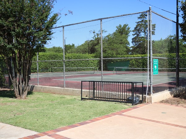 Tennis courts located next to the pool and clubhouse 