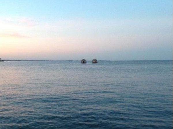 Tiki huts floating on Lake St. Clair
