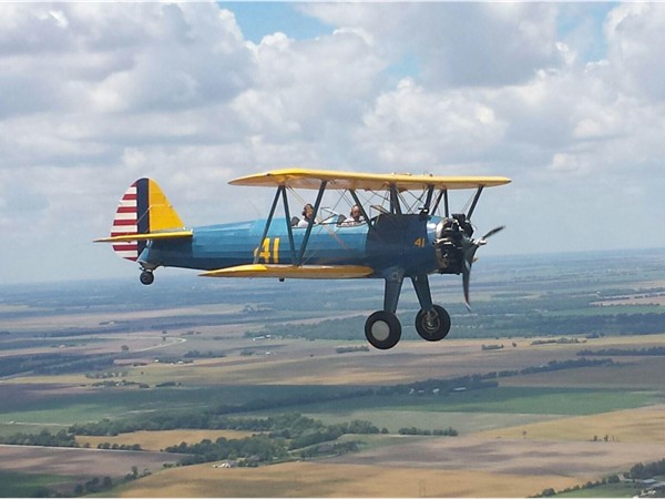 Stearman plane flying from Augusta airport to Stearman Field in Benton
