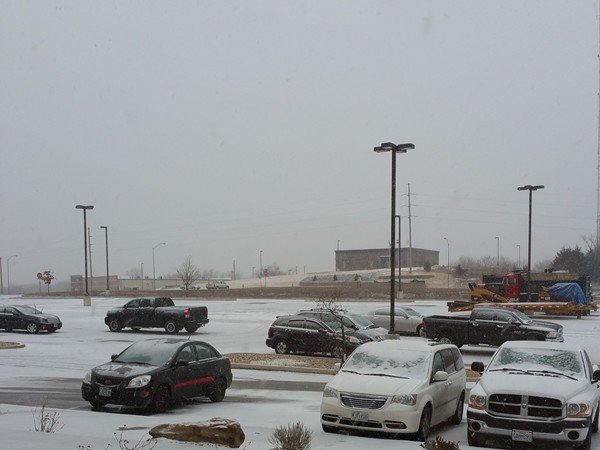 Snow is falling in Warrensburg