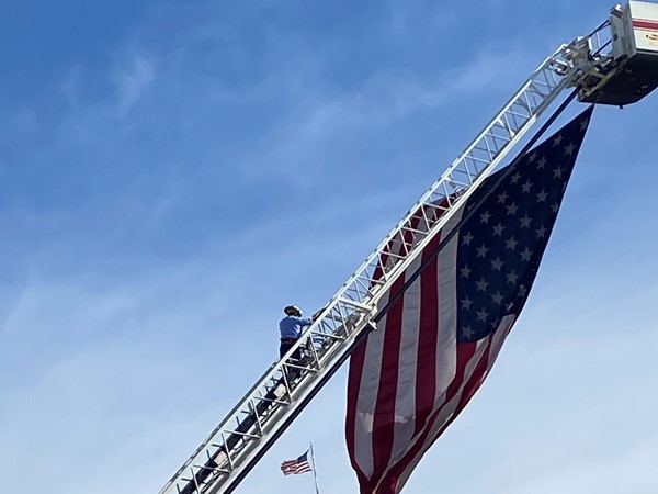 Fireman on ladder during National Anthem