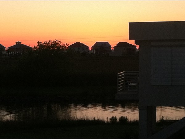 Sunset over Treasure Isle seen from back deck in neighboring Rigolets Estates