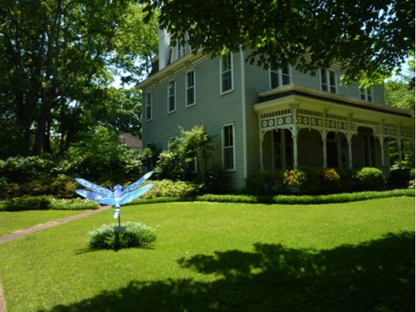Painted dragonfly on the lawn of a historic home in Decatur, Alabama